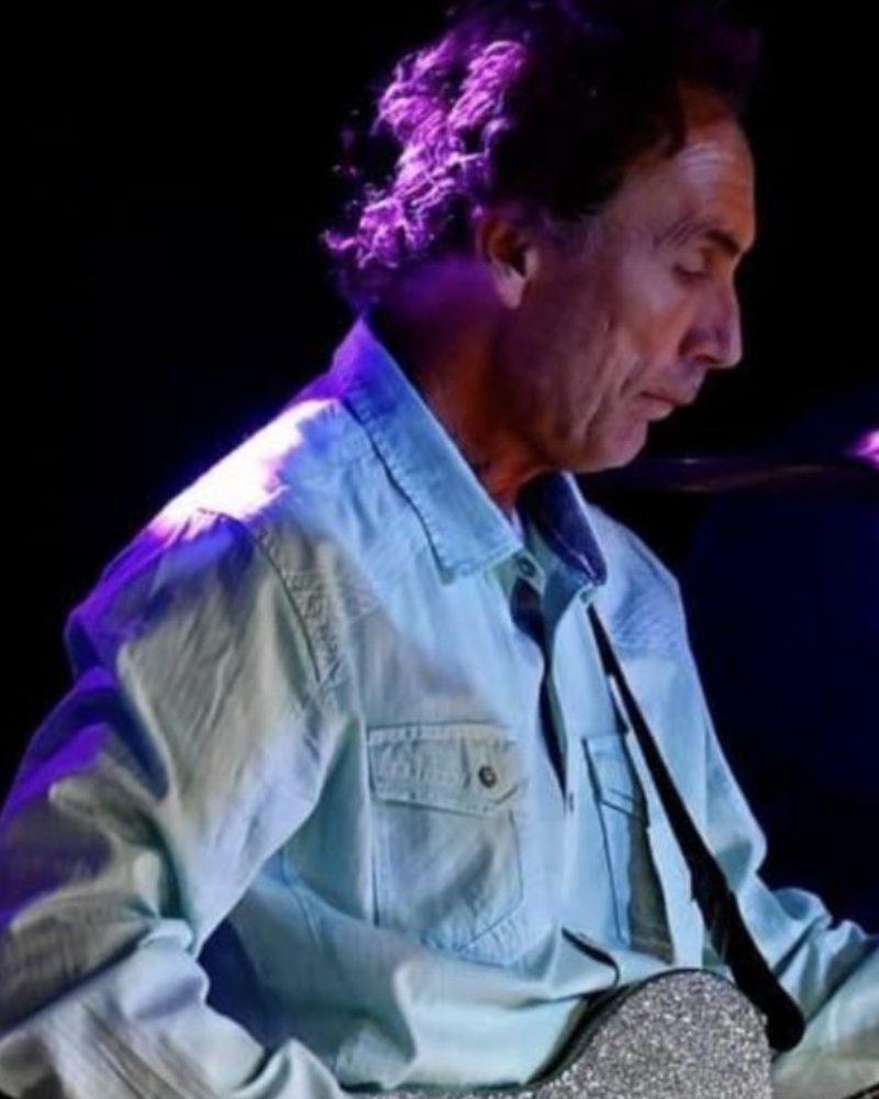 Jamie, lead guitarist of Runaway Train, playing on stage