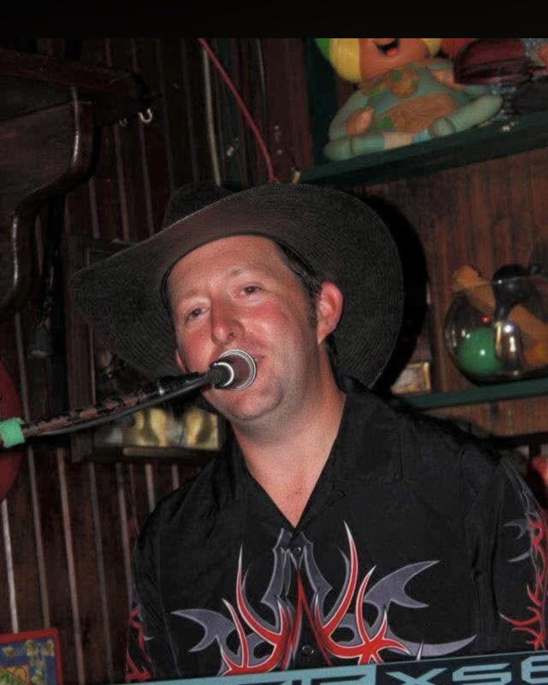 Mike Hatfield singing at the keys